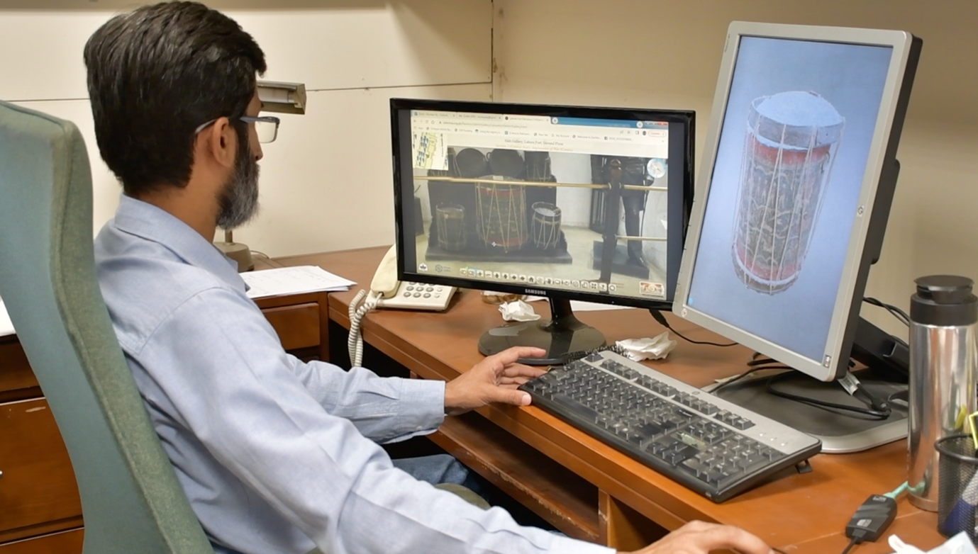 Dr. Taj exploring panoramas and 3D models of recorded artefacts.